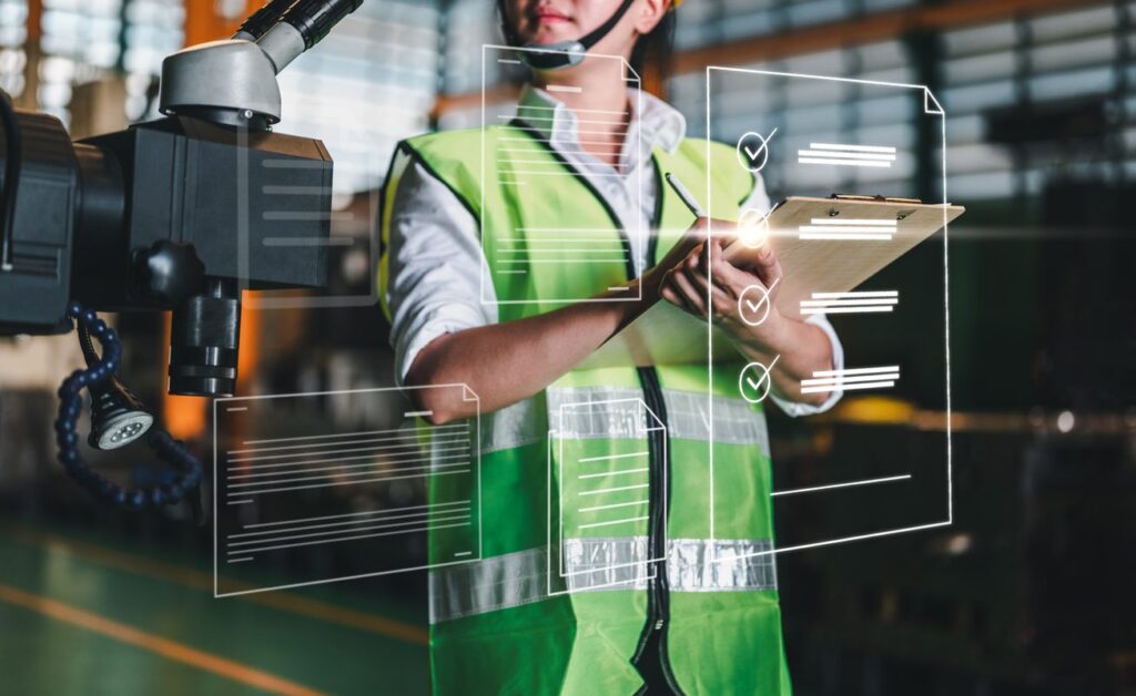 A woman is depicted with a keyboard looking at workflow digital components rendered on an invisible glass screen.
